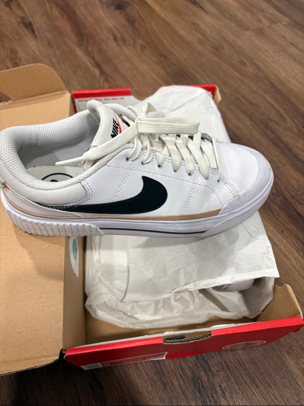 Nike White Low-Top Sneakers with Black Swoosh and Tan Trim